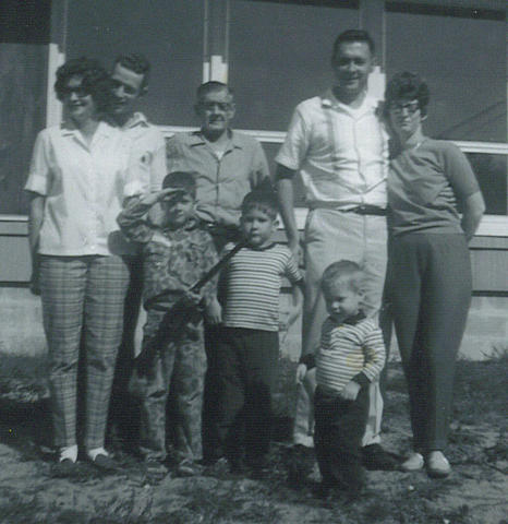 Left to right: Jeannette [Mom] & David [Dad] Staples, Keith Houde [cousin], Pepère Houde [grandfather], Darryl Houde [cousin], Normand Houde [uncle], David Houde [cousin], Anita Houde [aunt]. (Kp hasn't been invented yet.)